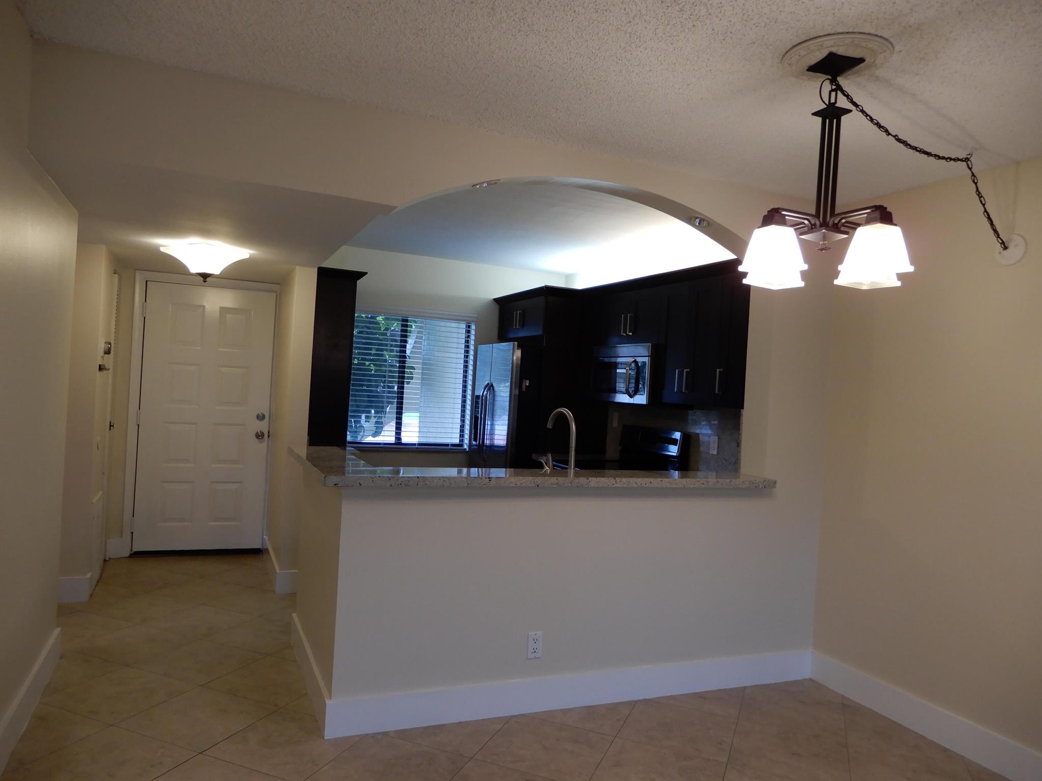 Updated cherry cabinets. Extra storage in kitchen. Granite couuntertops. Freshly painted. Tiled throughout. Walk to YMCA and shopping.