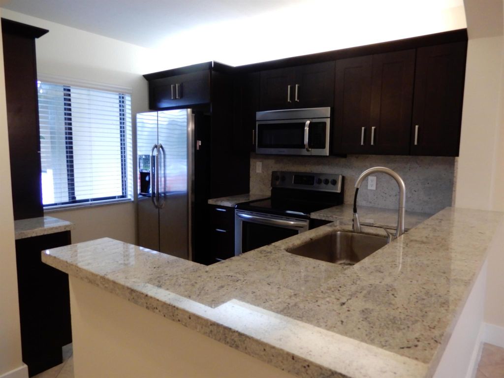 Photo of 6585 Somerset Drive #102, Boca Raton, FL 33433 (MLS # R11115496)