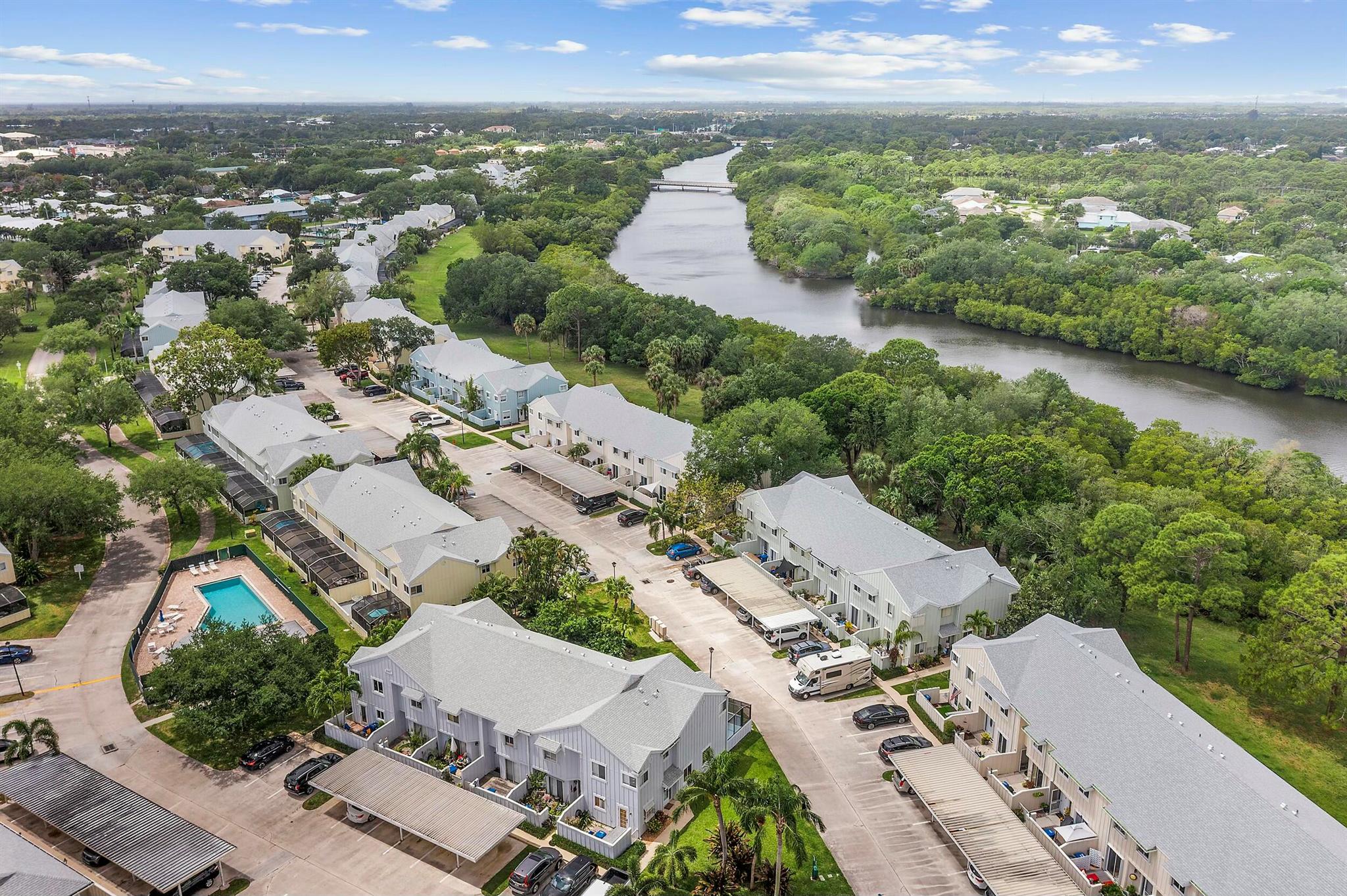 Love the outdoors? This spacious 2-bedroom, 2.5-bathroom townhome in the waterfront Riverwalk community is perfect for boating, kayaking, and paddleboarding enthusiasts!Step inside to discover a new roof, fresh paint, new plumbing, and a brand-new AC system. The entry-level features a spacious living and dining area, a kitchen with upgraded cabinetry, and an in-unit washer/dryer. The new hot water heater ensures efficiency, while the recently updated front patio offers a welcoming entrance.Upstairs, you'll find two oversized primary suites, each with newly remodeled bathrooms and huge attic storage, accessible from both bedrooms. Unwind on your screened-in patio, perfect for enjoying Florida's year-round sunshine.