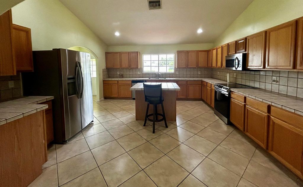 Photo of 1658 SW Import Drive, Port Saint Lucie, FL 34953 (MLS # R11084268)
