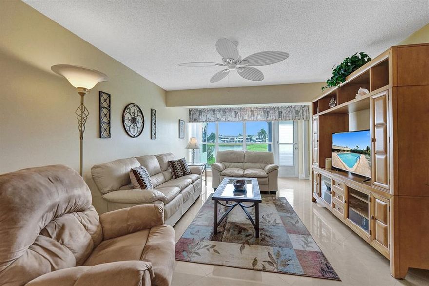 PINES OF DELRAY WEST. Rarely available LAKEFRONT 1167 square foot 1st floor CORNER  2 bedroom - 2 bath condo  with a 192 sqft screened patio in a peaceful waterfront setting.  Sharp looking  modern wall colors;  stunning 19.5'' x 19.5''  cirrus  porcelain tile throughout (on the diagonal); 2018-installed Bryant ''Legacy''  2 ton - 14 seer AC system; no awning windows ; 5 PGT windows including living room; roll-downs on patio and window hurricane panels if ever needed. The 17 foot long eat-in kitchen (with dome ceiling removed) features a  2021 GE  5.3 cu.ft. capacity range , a Frigidaire 18.2 cu. ft. top-freezer refrigerator, a Magic Chef large capacity dishwasher, and a Whirlpool laundry center. Updated electrical panel, 4 paddle fans and no obsolete wallpaper or wall mirrors to remove! WELCOME TO THE PINES OF DELRAY WEST!

The Pines of Delray West is a vibrant condominium community of 288 units within 42 buildings. It was built on 30+ acres (including a lake) in 1978-1979 by Carman Development LTD and is within the city limits of Delray Beach- located just off the northwest corner of Homewood Blvd and Linton Blvd. Only 12 of the 42 buildings--including the one in which this listing is located -- are situated on the lake. 

At least one approved buyer must be me at least 55 years of ago. And approved co-occupants must be at least 18 years of age. Occupants under the age of 55 can only reside on the premises if at least one 55+ occupant is in residence at the same time. Persons under 18 years of age are allowed to stay as a guest for up to 30 days per calendar year.

People at the Pines of Delray West are very friendly, there are lots of things to do and the grounds look great. The community includes a clubhouse, a 60' x 30' heated pool, an exercise room, a library room, and a community room. Sports activities include bocce ball, pickleball and tennis. INCLUDED in your 2022 monthly condo fee of $395 are fully funded reserves, water & sewer and basic cable. AND starting August 1st fiber optic cable, high definition service, SHOWTIME AND in-unit WIFI will also be included. The condo fee also covers roof repair and replacement, exterior painting, parking area paving and all lawn care services. Building insurance is included, but you should get (as it is not mandatory) your own so-called HO-6 "walls-in" homeowners insurance policy.

SORRY, but-- pets- trucks- vans -campers- recreational vehicles- boats- golf carts- limousines- motorcycles and vehicles with exterior signage are not permitted. And a unit must be owned for 18 months to be eligible to be leased out and then the lease must be for a 4-month minimum and only one lease is allowed per each 12 month period

And unlike some other nearby condominiums NO special assessments are in effect or pending. And there is NO new owner capital contribution fee, NO clubhouse renovation fee/building fund, NO recreational lease and NO special time restrictions as to when your guests can use the clubhouse, exercise equipment or swimming pool.

The Pines of Delray West is conveniently located with easy access to I-95 and only a 2.5 mile drive to the Atlantic Ocean and beach parking. It is also only 3.5 miles from the widely popular "downtown Delray Beach" with its 80+ restaurants, taverns and coffee shops. The Pines of Delray West is around a 30 minute drive to either Palm Beach International Airport or Fort Lauderdale/Hollywood International Airport via I-95 (except during rush hour)

South Florida's professional sports teams- the Miami Dolphins, the Miami Heat and the Florida Panthers - all have arenas in either Broward or Dade County. South Florida also has three NCAA Division 1 college football & basketball programs - namely the University of Miami Hurricanes, the FIU Panthers and the Florida Atlantic University Owls. Only the Florida Atlantic Owls are in Palm Beach County and play at a stadium in Boca Raton. There is one poker room (60 tables) in all of Palm Beach County. Las Vegas style casinos, slot machine-only casinos and horse racing are prohibited in Palm Beach County but are available in Broward and Dade County. Greyhound racing is now banned throughout the state of Florida.

NOTE: The above information is not warranted nor guaranteed as 100% accurate. It is subject to inadvertent error, omission, miscalculation and misinterpretation. Prospective buyers need to independently verify the accuracy of the information presented