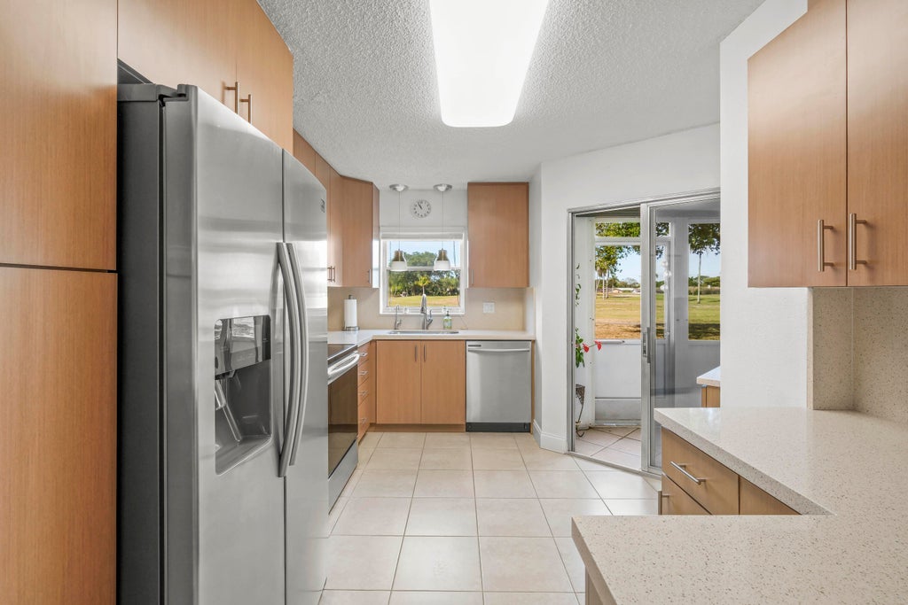 Photo of 3871 VIA POINCIANA #104, Lake Worth, FL 33467 (MLS # B26082603)