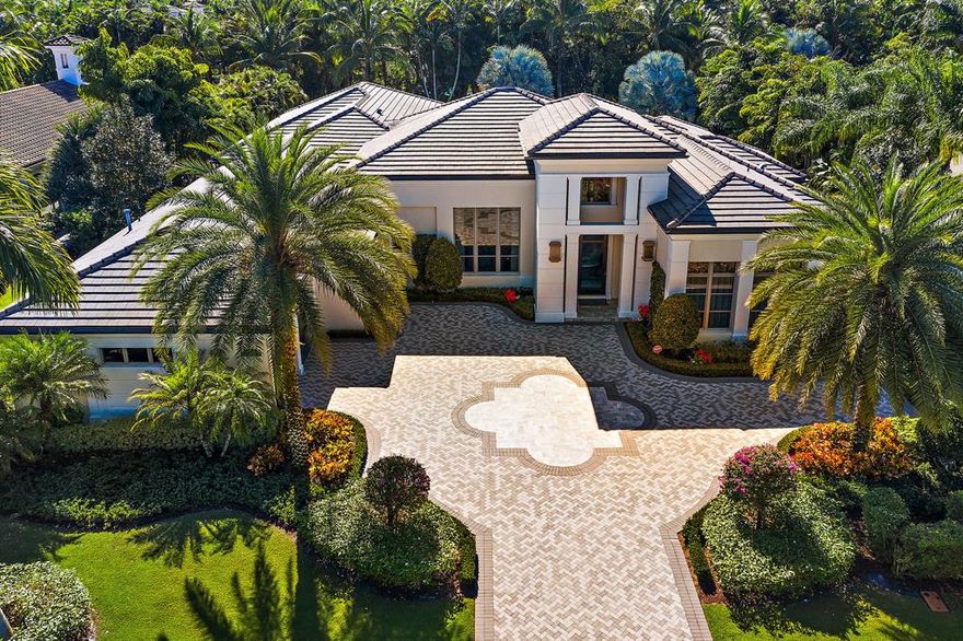 This stunning Castillo II Model is not one to miss! All new professionally decorated and situated on a 1/2 acre lot in the Grand Estate section of Old Palm Golf Club.  Contemporary architecture, hurricane impact glass windows, impeccable landscaped grounds with beautiful resort-like custom lap pool w/platform lounging area, mosaic glass tiled spa. Kitchen and family room sliding glass doors pocket into the wall to open up into the expansive covered lanai w/summer kitchen, cabana bath fire pit, natural gas Wolf Grill. Polished light limestone floors beautifully contrast the dark wood kitchen cabinets. The gourmet kitchen has top of the line SS Wolf double ovens, 6 burner cooktop and microwave.  Subzero 36in refrigerator & 36in freezer. Spacious Master bedroom His/Her baths. A must see!