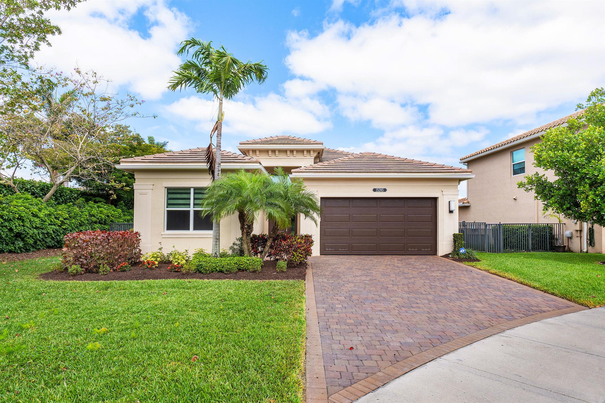 Discover this lovely residence nestled in the vibrant Dakota community of Delray Beach. Enjoy serene water views and lush garden scenery from every angle. This 3 bedroom 2.1 bathroom home boasts sleek tile flooring throughout, an inviting open floor plan anchored by a spacious kitchen island with granite countertops and stainless steel appliances. Hurricane impact glass windows and doors throughout, an abundance of natural light, no carpet, and an inviting covered patio area perfect for relaxing or entertaining. Move-in ready, and settled in a cul-de-sac, indulge in immediate comfort, convenience and ultimate privacy!