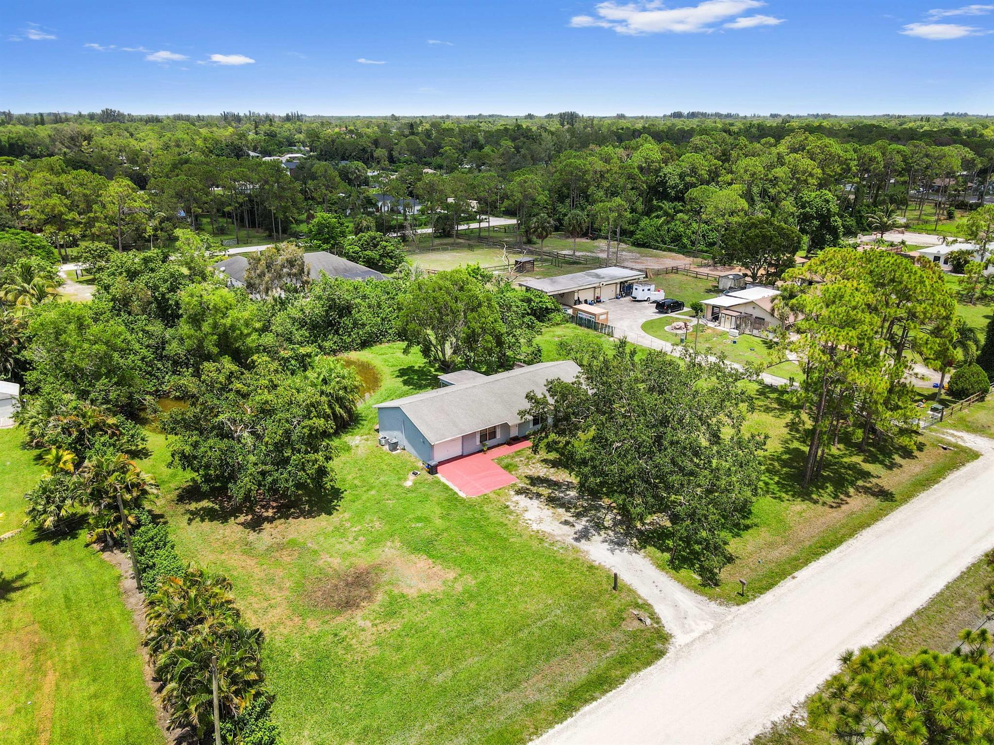 Prepare to fall in love with this beautiful 3-bedroom, 2-bath home, perfectly situated on a generous 1.15-acre lot in a highly desirable location. This residence offers the perfect blend of modern updates and serene outdoor living. Step inside to discover stylish vinyl flooring that flows seamlessly throughout, creating a contemporary and easy-to-maintain aesthetic. The heart of the home, its kitchen, boasts elegant quartz countertops and a sleek undermount stainless steel sink, ready to inspire your culinary creations. Both bathrooms have been recently renovated, adding to the home's fresh and inviting appeal.