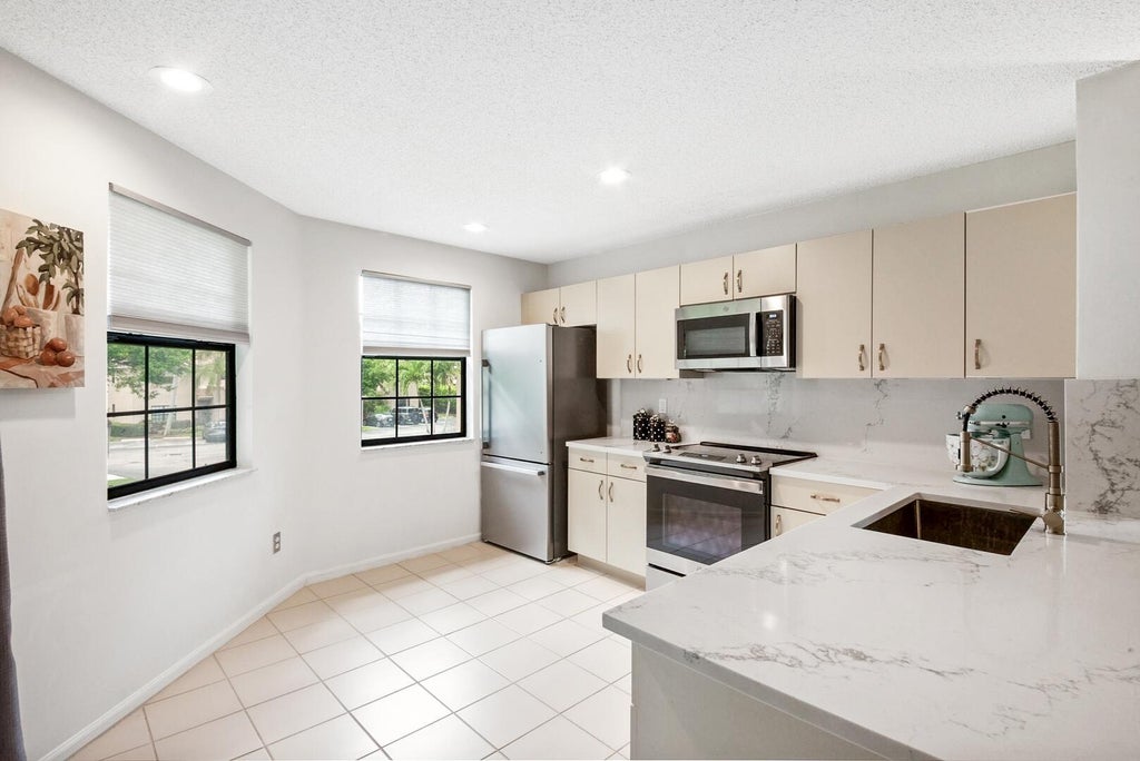Photo of 6690 Montego Bay Boulevard #F, Boca Raton, FL 33433 (MLS # B26079891)