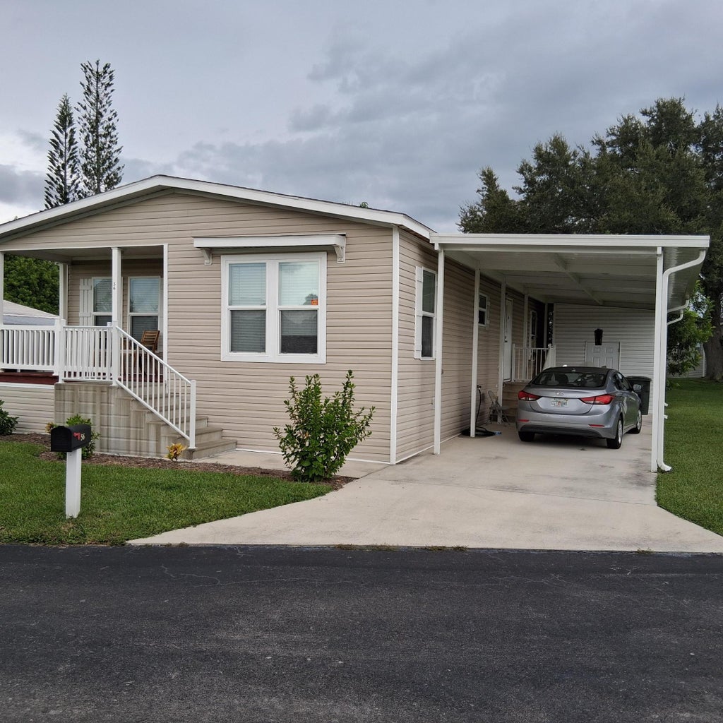 Photo of 56 Manor Drive, Fort Pierce, FL 34982 (MLS # B26079224)