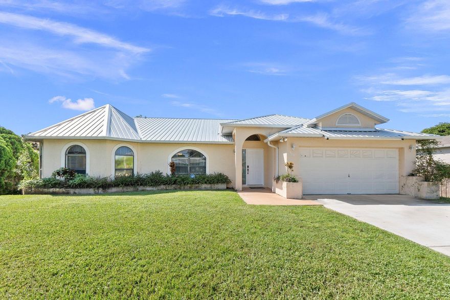 This beautiful 3-bedroom, 2-bathroom CBS home offers nearly 1,800 sq. ft. of living space and is move-in ready! Featuring a 2022 metal roof, 2023 Hot Water Heater, and 2018 AC. The bright kitchen includes white cabinets, stainless steel appliances and coffee bar. The home offers two spacious living areas, a formal dining room, and tile flooring throughout. Enjoy outdoor living with pocket sliders, a huge screened-in patio and a large fenced backyard, perfect for relaxing or entertaining. Located in a prime location near shopping, restaurants, beaches, and highways—with **no HOA**