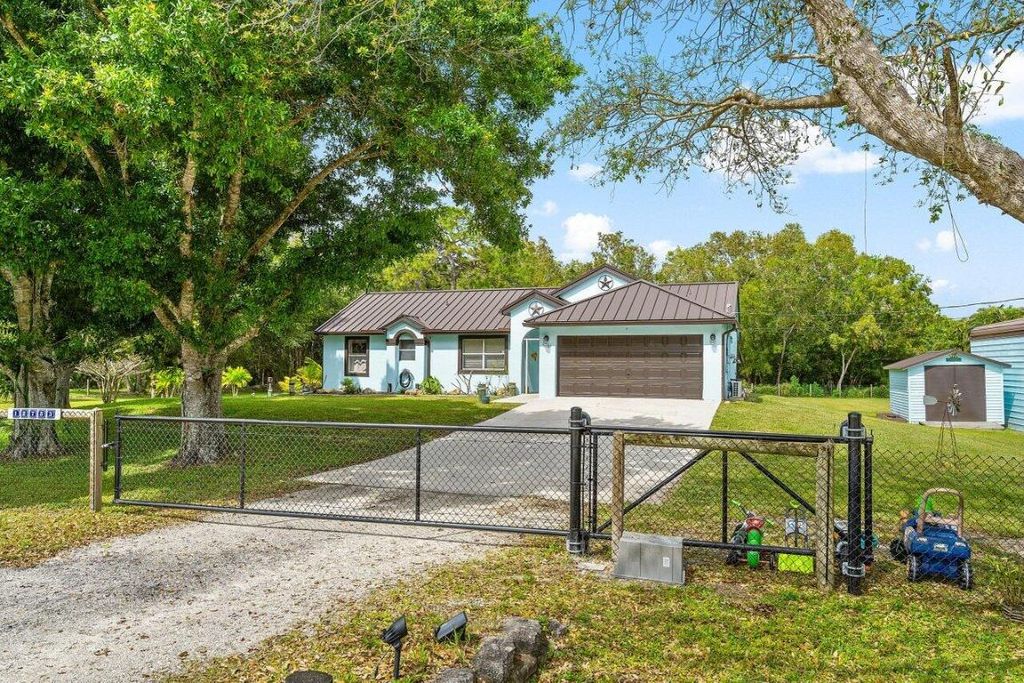 Photo of 12783 83rd Lane N, West Palm Beach, FL 33412 (MLS # R10965880)