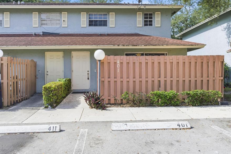 Totally renovated and move-in ready, this stunning 3-bedroom, 2.5-bath end-unit townhouse feels like new construction. The upgraded kitchen features stainless steel appliances, granite counters, white shaker cabinetry, pendant lighting, and barstool seating. The master suite is conveniently located on the ground floor with a large walk-in closet and a beautifully tiled step-in shower. Enjoy modern laminate wood flooring throughout, freshly painted light gray walls, thick baseboards, and ceiling fans in every room. The home offers two private courtyards--one spacious in the front and another off the master bedroom--perfect for relaxing or entertaining. With plenty of natural light, storage space, and a full-size washer and dryer, this home combines comfort and style. Ideally situated in a