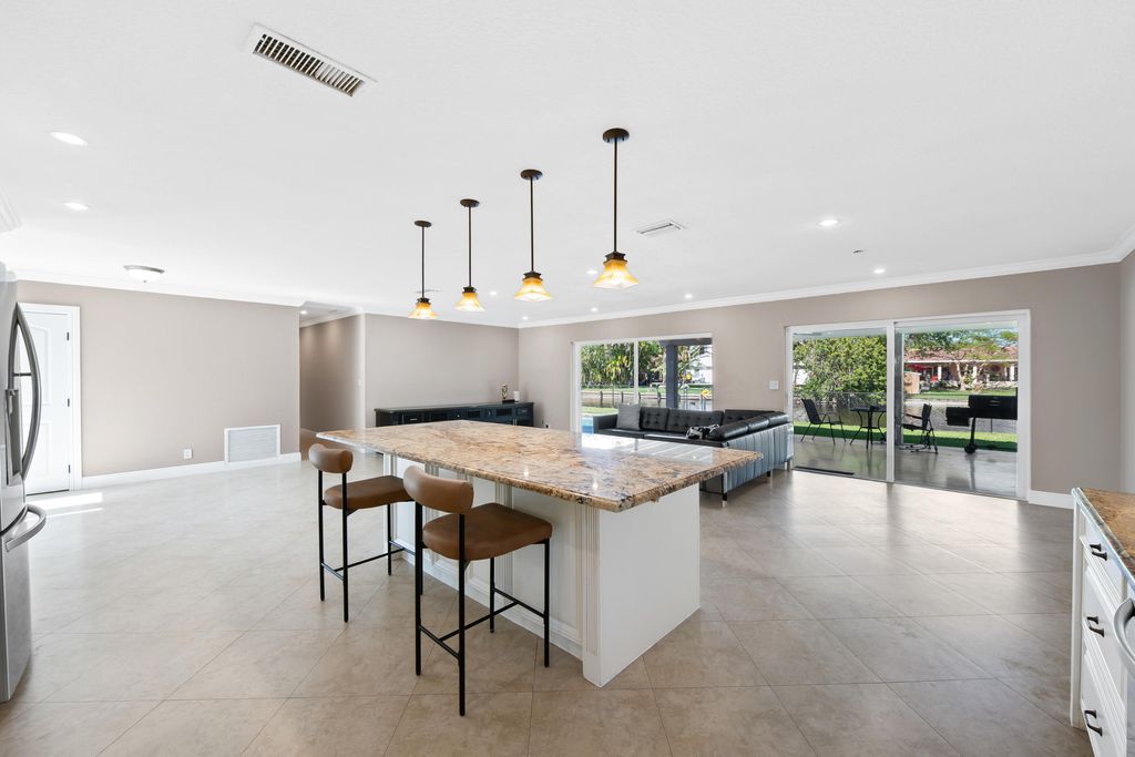 Photo of 1120 Renmar Drive, Plantation, FL 33317 (MLS # B26000278)