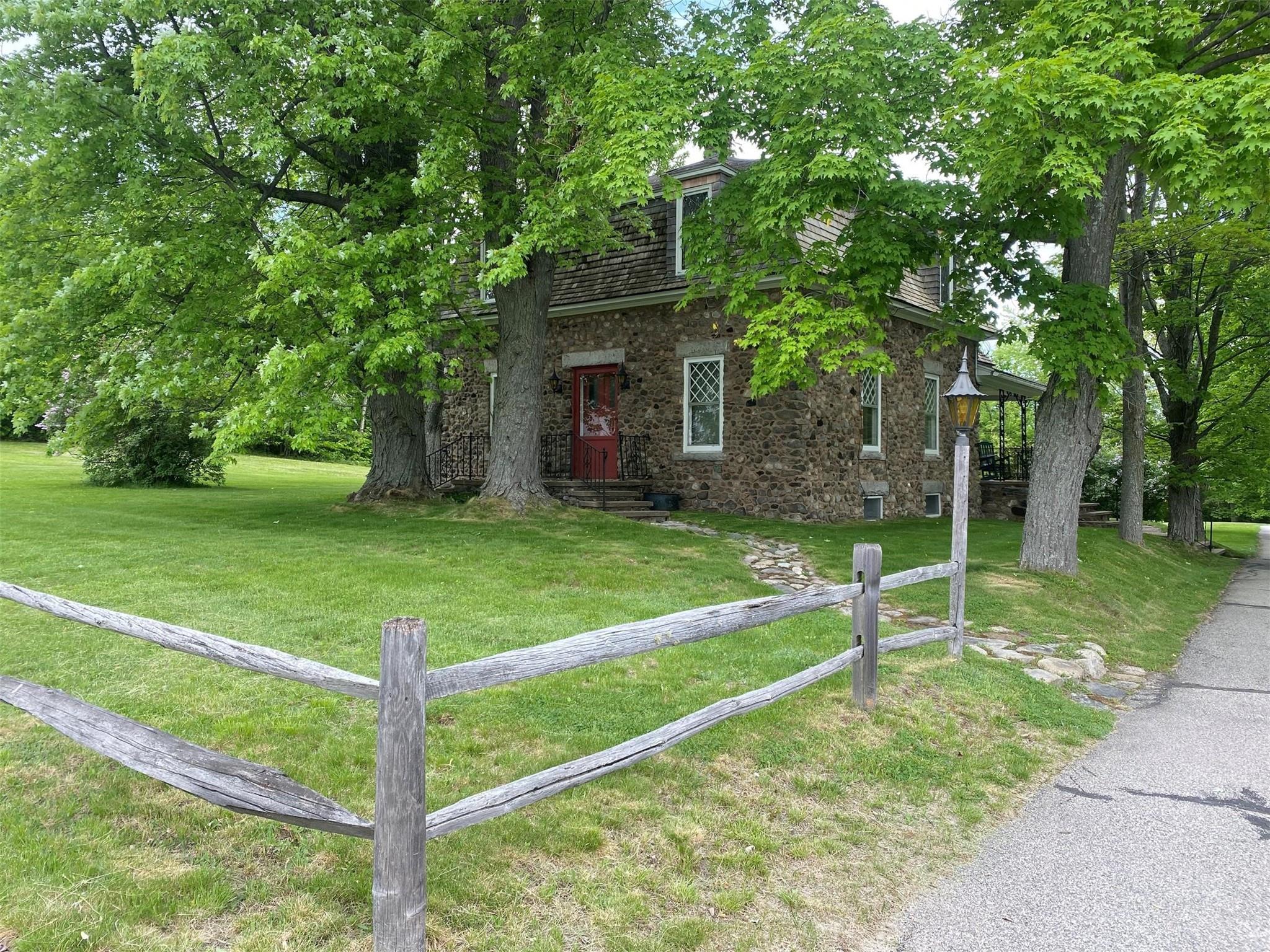 Beautiful FRENCH PROVINCIAL home in Berlins’ Estate, on an expansive level 1.2 acre lot. This 125 yr old Riverstone 2 story home has been completely renovated to blend historic charm w/modern comfort. Original leaded glass windows, ornate wood crafted interior staircase w/intricately carved woodwork showcase the craftsmanship of a bygone era. 2' deep windowsills, 100 year old maple trees & scenic views create a picturesque setting. New high efficient propane FHW heating, mini-split a/c, extensive new wiring & electrical. 3 bdrms, 3 baths, laundry facility, cleaning closet &b basement offering storage & workbench. Detached single-car garage. Enjoy the quiet neighborhood, w/wild game passing through. Nestled in a serene setting providing stunning views of the Presidential Mountains.