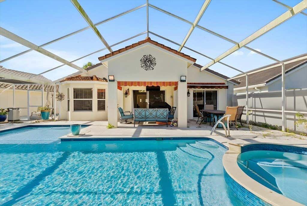 Photo of 7534 Ironbridge Circle, Delray Beach, FL 33446 (MLS # B26061872)