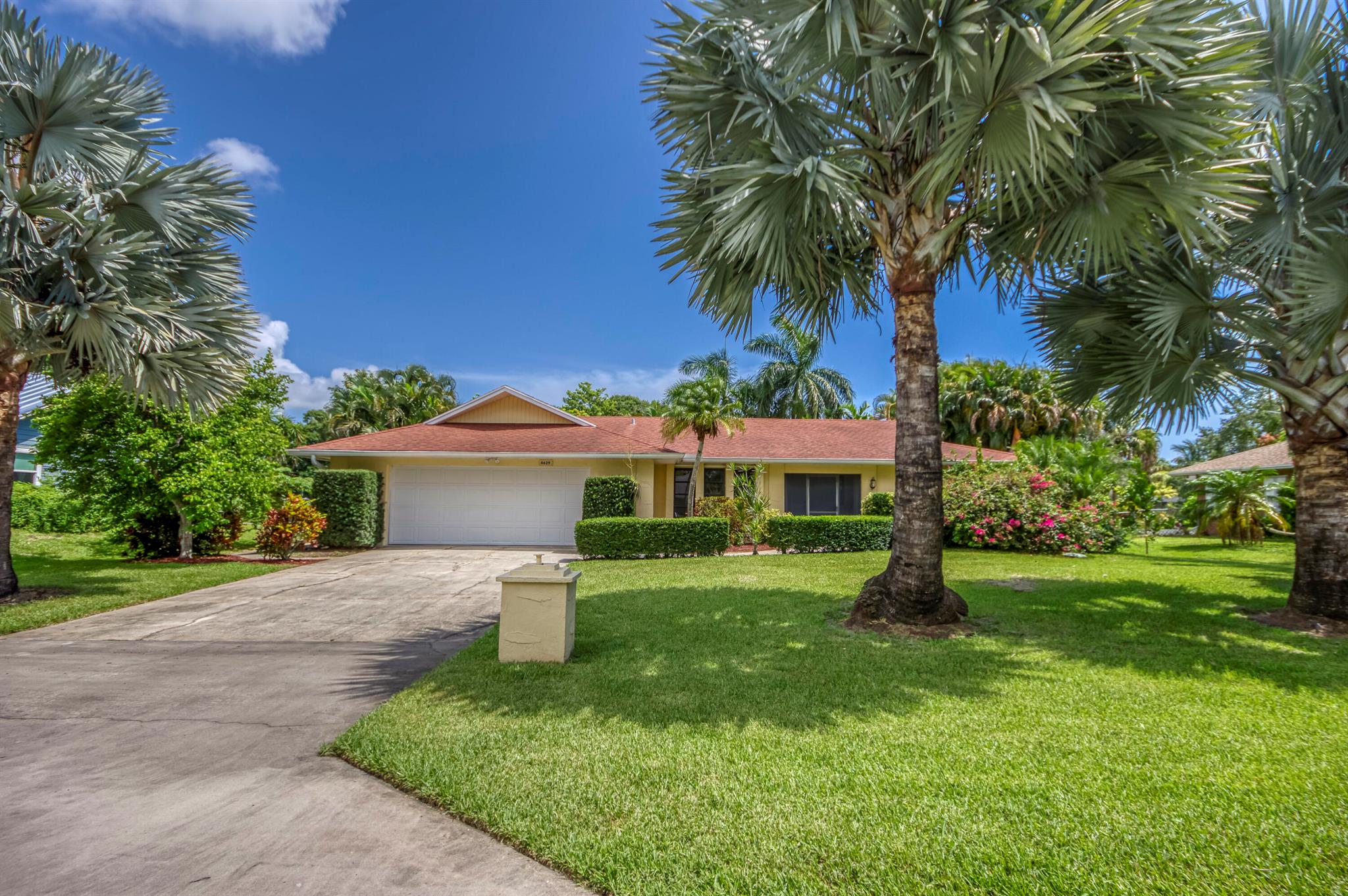 Welcome to 8629 SE Duncan Street - a rare gem in the highly sought-after Hobe Hills community, where classic Florida charm meets unbeatable location. This spacious 4-bedroom, 3-bathroom pool home offers nearly 2,600 square feet of comfortable living space with fireplace and the peace of mind that comes with solid concrete block construction. Situated on a lake lot with no HOA, this property offers fruit trees and privacy with scenic views. Step inside to discover a thoughtfully laid-out floor plan complemented by newer upgrades, including a 2017/2018 AC system, 2017 KitchenAid stainless steel appliances, and 2020 accordion hurricane shutters and pool pump. A brand-new screened patio enclosure (2024). Live minutes from Jupiter Island's pristine beaches, Tequesta's dining scene, and local