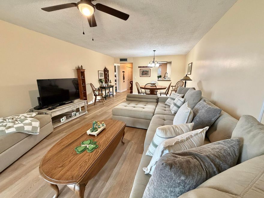 Welcome to Palm Lakes, a sought after 55+ community offering comfort, convenience, and an active lifestyle. This beautifully renovated and spacious 1 bedroom, 2 bathroom condo is truly move in ready. Thoughtfully updated in 2024, the home features a hurricane impact front door and impact windows for enhanced security, energy efficiency, and peace of mind. A newly enclosed 28 x 10 patio with impact windows adds exceptional bonus living space, perfect for relaxing, entertaining, or creating a bright home office retreat. Stylish new water resistant laminate flooring throughout gives the entire residence a clean, modern feel. The updated kitchen showcases stainless steel appliances and granite countertops, blending functionality with timeless design. Plantation shutters and elegant zebra blinds add both privacy and sophistication. The AC unit was replaced in 2018, providing reliable year round comfort. Ideally positioned right off the elevator for easy access, this unit also includes convenient outside storage. Minimum credit score requirement is 650. Enjoy low maintenance living in a well maintained community, close to shopping, dining, and everything you need. This is the perfect opportunity to enjoy a stylish, updated home in one of Palm Lakes' desirable 55+ settings. ***No special assessments!!