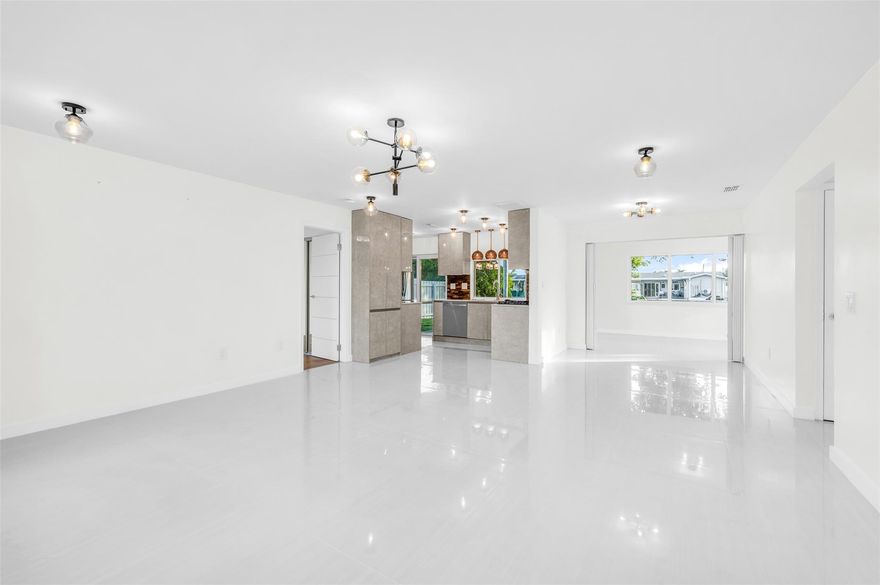 Immaculate waterfront fully renovated - more than 100K, everything permitted - home located in a family friendly, safe neighborhood, near Sawgrass Mall and other shopping and entertainment. Indulge in the comfort and serenity of this open concept contemporary luminous interior. New kitchen has designer cabinets and brand-new appliances. Modern bathrooms feature glass enclosed showers and custom-made vanities with quartz tops. 
Common area has new porcelain floors and bedrooms have new hardwood floors. House has new lighting fixtures, new interior doors and hardware, fresh paint. New hurricane proof windows/doors, new concrete driveway and privacy fence were just added, the exterior stucco landscaping and irrigation were updated. Back patio offers a tranquil vibe overlooking the water view