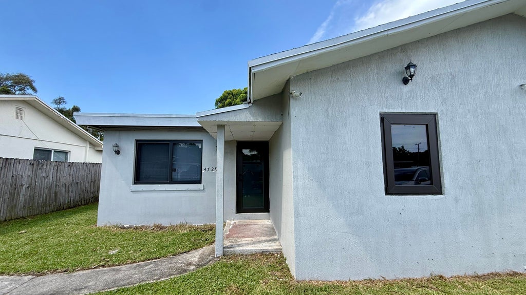 Photo of 4729 Myrtle Lane, West Palm Beach, FL 33417 (MLS # B26066064)