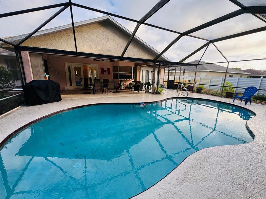 Beautifully Maintained 3BR/2BA Valentine Builders Pool Home!This charming, custom-built residence sits on a beautifully landscaped lot in a peaceful, well-established neighborhood. Step inside to a bright and inviting open layout filled with natural light from skylights and French doors leading to the screened-in pool area--perfect for enjoying the Florida lifestyle year-round.Freshly painted inside, this home offers vaulted ceilings in every room, a cozy breakfast nook with a bay window overlooking the pool, and all-tile flooring--no carpet! The three bedrooms feature upgraded wood-look tile, and most rooms are equipped with dimmable lighting. ATT Fiber Optic Internet service ensures fast and reliable connectivity.The brand-new modern kitchen (2024) boasts stylish cabinetry