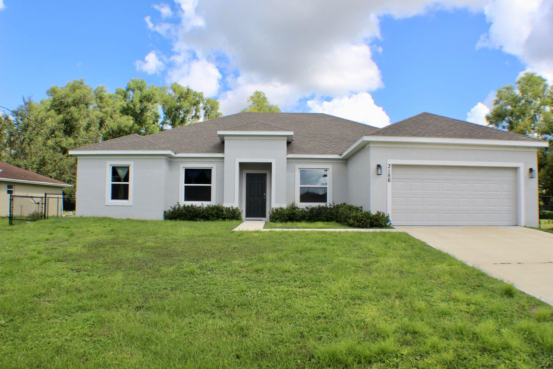 Welcome to your dream home in beautiful Port St. Lucie! Built in 2023, this stunning 4-bedroom, 3-bath single-family residence offers modern living with an open and functional layout perfect for families and entertaining.Enjoy cooking in the stylish kitchen featuring stainless steel appliances, sleek cabinetry, and a spacious island that flows effortlessly into the main living and dining areas. The home includes a split-bedroom floor plan for added privacy and convenience.Step outside to a screened porch overlooking a large backyard -- perfect for weekend barbecues, gatherings, or simply relaxing under the Florida sun.Additional features include a 2-car garage, ample storage space, and a prime location close to major highways, shopping, dining, and top-rated schools.