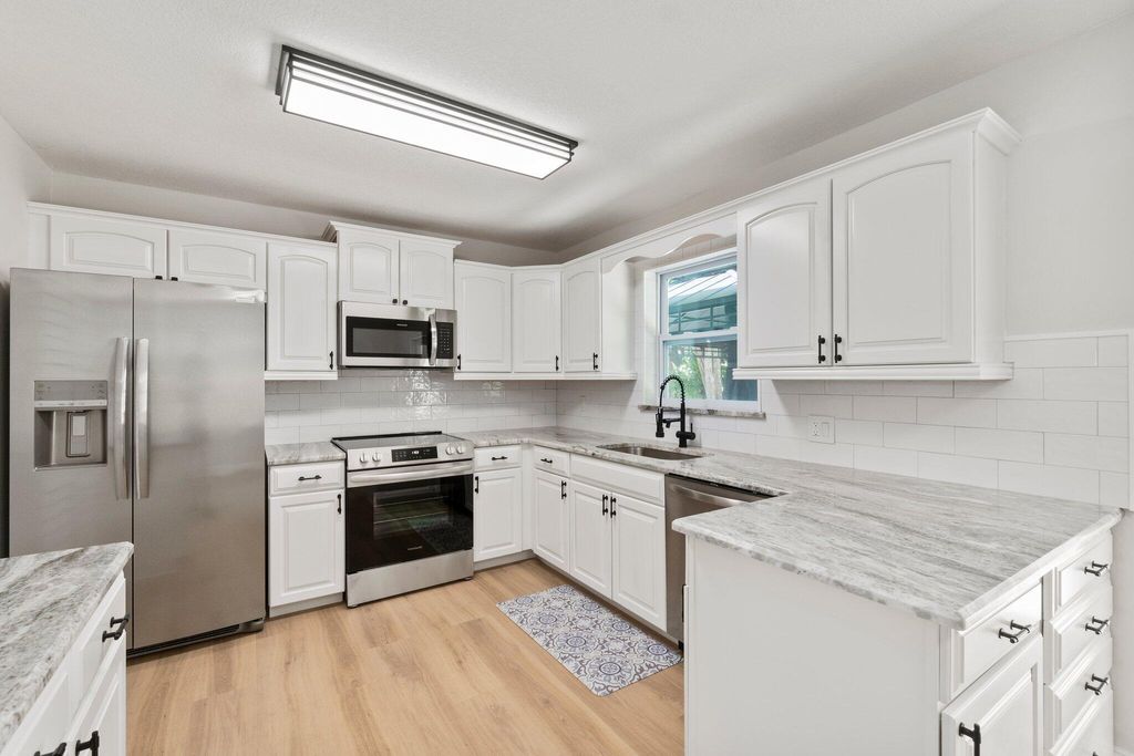 Photo of 2164 NE 15th Drive, Jensen Beach, FL 34957 (MLS # R10971977)