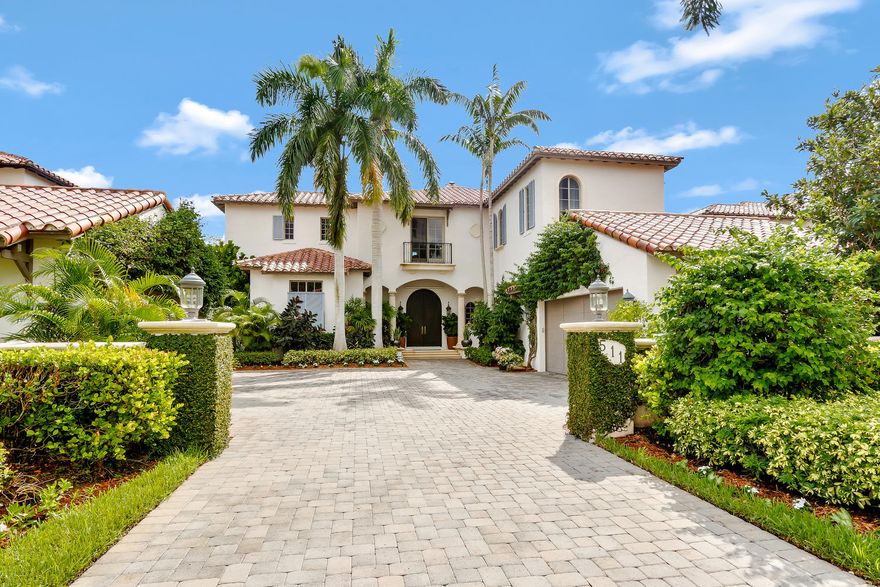 Gorgeous modern estate in Jupiter, Florida.  Life doesn't get any better than driving thru this pristine club, pulling up to your gate and seeing all the greenery and beauty of living in Paradise.  As you enter this open airy 5 bedroom home you are impressed by the updated and meticulous surroundings.  Gourmet kitchen, large family room and dining room make this home perfect for entertaining.  Outside is a gorgeous area for al fresco dining.  Relax while listening to your favorite music while taking a dip in the pool or spa.  As you make your way upstairs you will find 4 other bedrooms one has been converted to a media room. The grand loft is a perfect area for kids and grandkids.