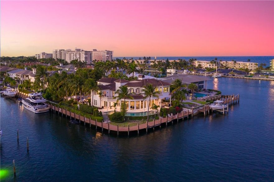 Half an acre and its own private gated entrance, this estate is unlike any other property in Lighthouse Point. Sweeping intercostal views from this property which is sited on a double oversized lot and has a large motor court with a sprawling courtyard. Positioned on the South Grand Canal, this point lot has 280 +/- feet of water frontage. All prominent rooms take advantage of the wraparound waterfront views. The interior consists of just under 8,000 sqft which includes a mother-in-law suite and media room. Elegance is evident in each room with attention to detail, and the estate is fully equipped with smart home automation. Located on the most prestigious street in the city and minutes to Hillsboro Inlet & ocean by yacht