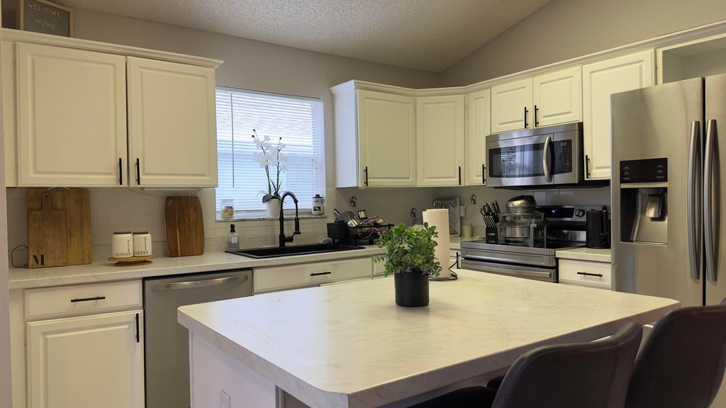 Photo of 320 Hammocks Trail, Greenacres, FL 33413 (MLS # R11021155)