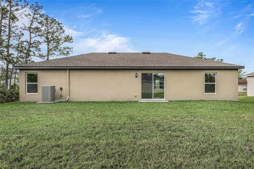Photo of 1079 SW California Boulevard, Port Saint Lucie, FL 34953 (MLS # F10393484)