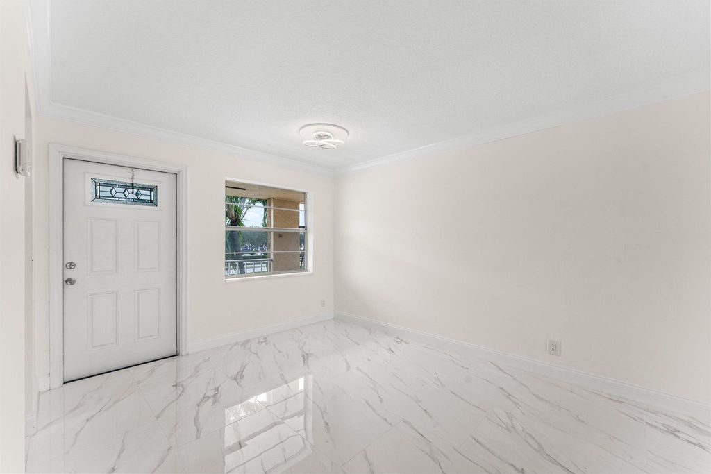 Photo of 9911 Sandalfoot Boulevard #113, Boca Raton, FL 33428 (MLS # R11148092)