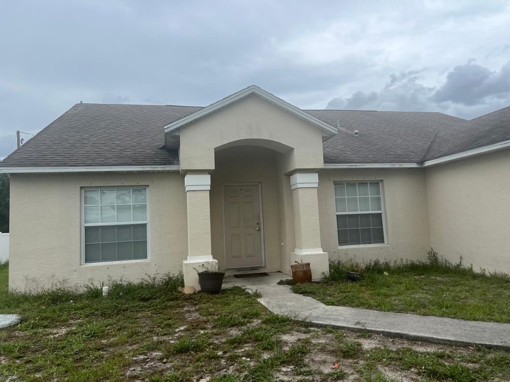 Photo of 1231 SW Parma Avenue, Port Saint Lucie, FL 34953 (MLS # B26034773)