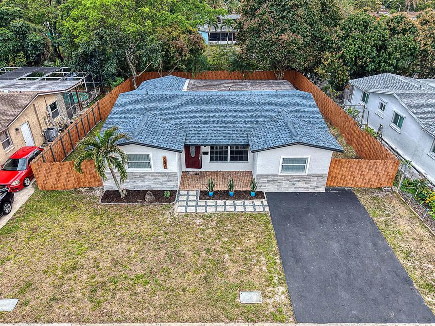 Modern Waterfront Living: Nicely Updated 4/2 Pool Home with Canal Views. Experience the perfect blend of peace and peace-of-mind in this stunning 4 bedroom, 2 bathroom residence located in the heart of North Lauderdale.  This home features a New Roof in 2025, an airy open-concept floor plan, fresh interior and exterior paint, modern flooring throughout, tasteful bathrooms, high hat interior lighting, modern tile in the living areas, waterproof vinyl flooring in rooms, newer HVAC unit, no HOA, a chef-inspired kitchen boasts New Stainless Steel Appliances and sleek shaker white cabinetry, French Doors, overlooking a spacious family room for easy entertaining. Retreat to the private backyard oasis, where a sparkling In-Ground Pool awaits you, with and a 6ft fence for ultimate privacy.