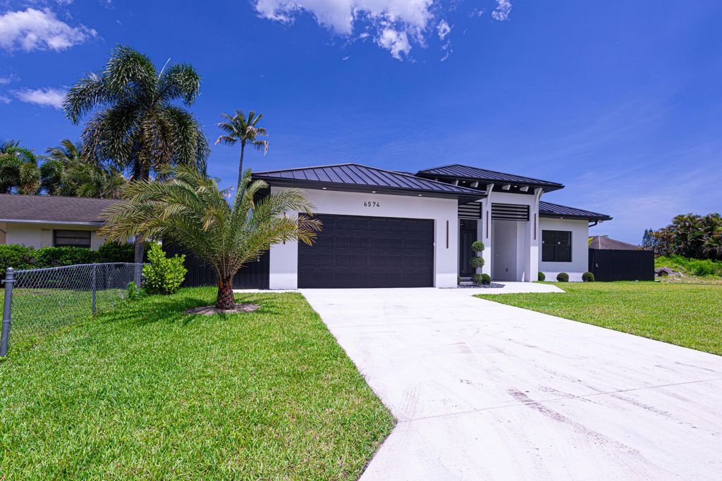 Photo of 6574 Rigger Road, Lake Worth, FL 33462 (MLS # B26024320)
