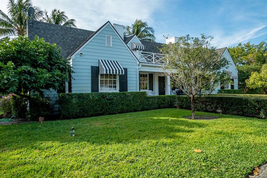 This beautiful home with separate guest house sits on a lushly landscaped 1.1 acre yard in the heart of Delray Beach.  The minute you drive through the gate, you will be swept away be the quintessential Florida charm complete with a front porch, large open rooms with plenty of windows and French doors leading to a back porch, heated pool and gardens.  Meander down the stepping stones to the guest cottage with one bedroom, a living room, kitchen and bath.  Your guests can enjoy their own private access from Periwinkle Lane.  The interior features porcelain and hardwood flooring, granite and marble finishes, and pecky cypress walls throughout.  The upstairs boasts a master suite with a cedar closet, marble shower, his and hers vanities and an extra bedroom.