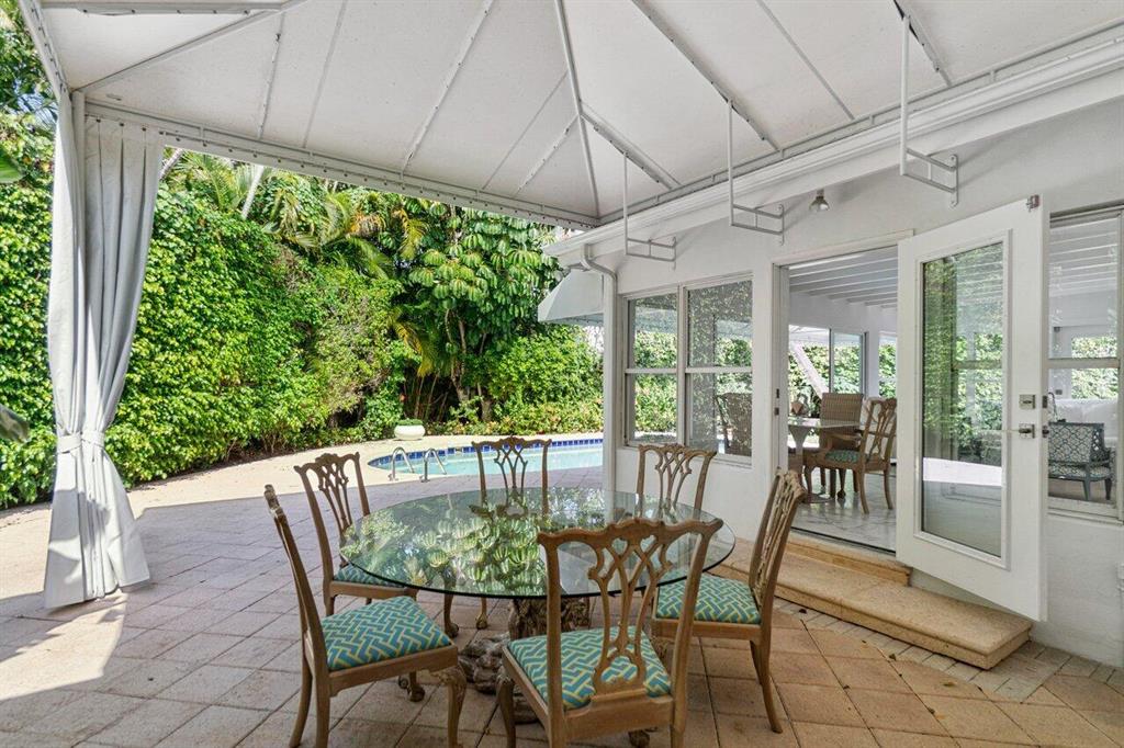 Newly renovated. Charming, Mid-century Modern home located on the North End. Sun-filled, open floor plan with new impact windows, a private pool and patio surrounded by updated landscaping. Renovated bathrooms, kitchen and laundry room.