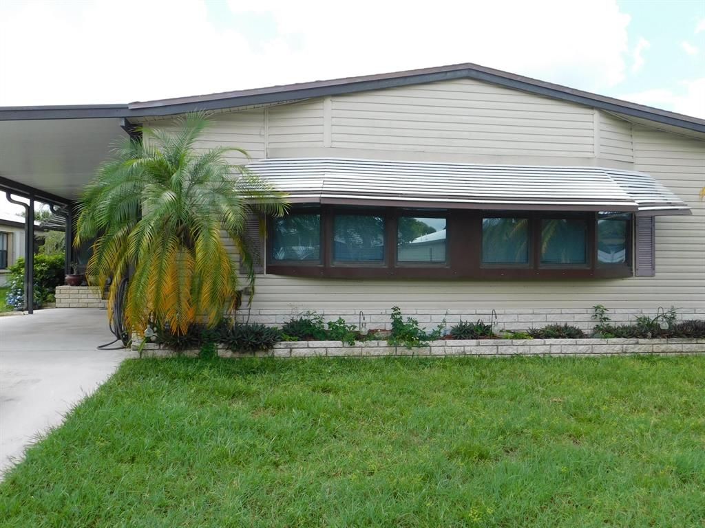 Photo of 14199 Cancun Avenue, Fort Pierce, FL 34951 (MLS # R10737565)
