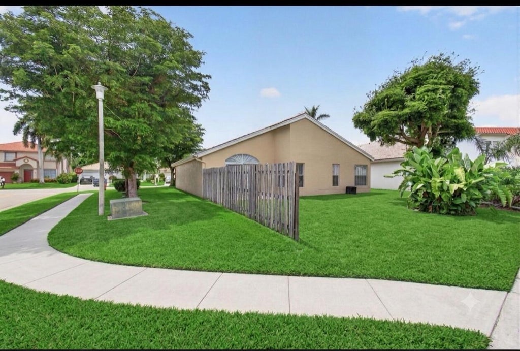 Photo of 7116 CATALINA Way, Lake Worth, FL 33467 (MLS # B26056113)