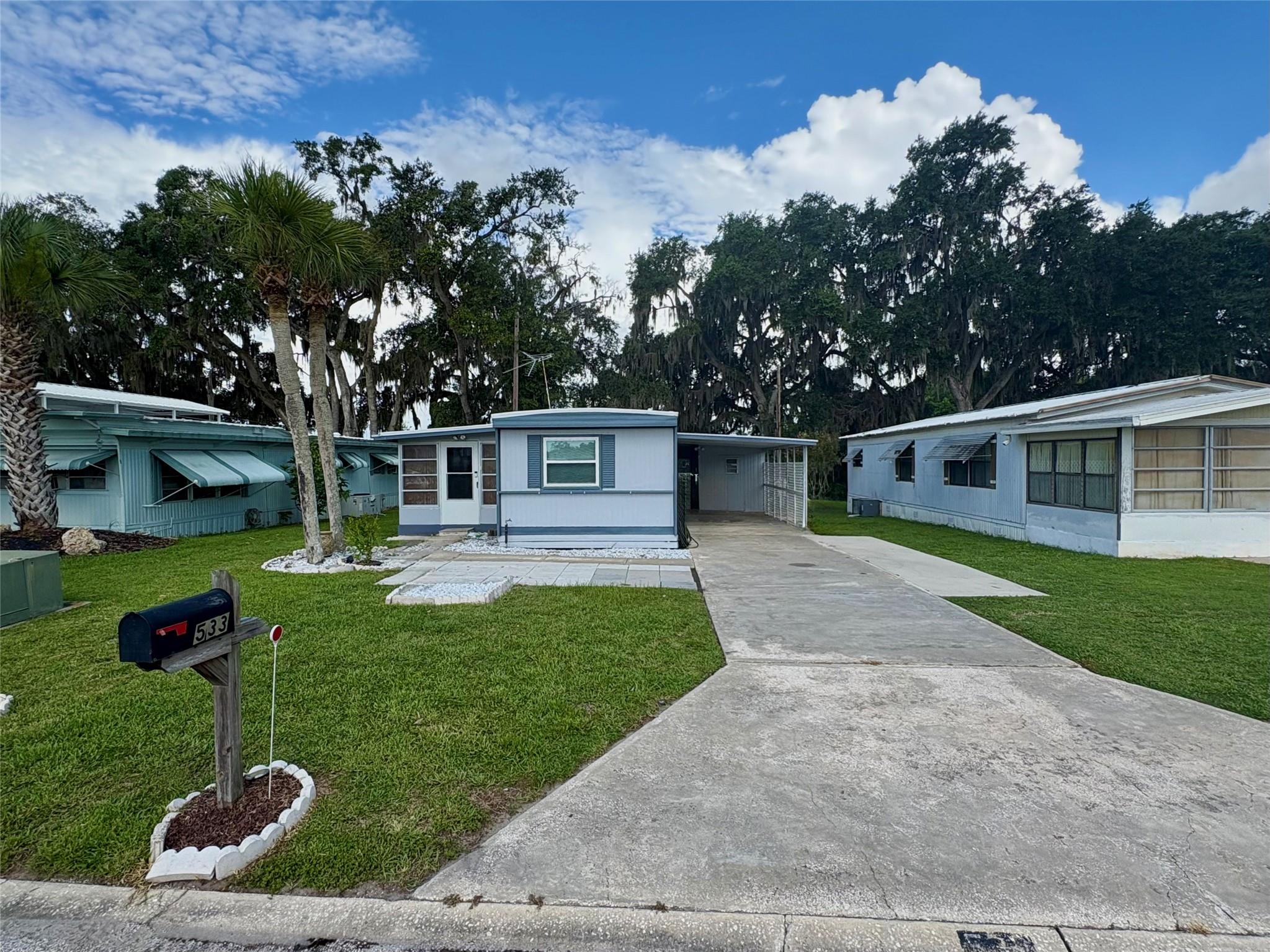 WOW! Updated Home – No HOA, No Lot Rent, and No Rear Neighbors! Welcome to this 3/2 beautifully updated and move-in-ready home offering comfort, privacy, and freedom with NO HOA and NO LOT RENT! Enjoy a spacious Bonus Room with A/C, perfect for relaxing year-round. The extended driveway and large back patio provide plenty of room for entertaining, hobbies, or just unwinding in your own space — and best of all, no back neighbor for added privacy with a fenced backyard and sided fenced area for your pets! Cut costs with the included TV antenna for free channels, and breathe easy with a special air filtration system installed in the A/C. Major upgrades completed in 2019 include the roof, A/C, energy-efficient double-pane windows, and new flooring!.