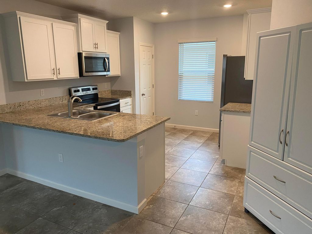 Photo of 10946 SW Robbia Way, Port Saint Lucie, FL 34987 (MLS # R10947822)