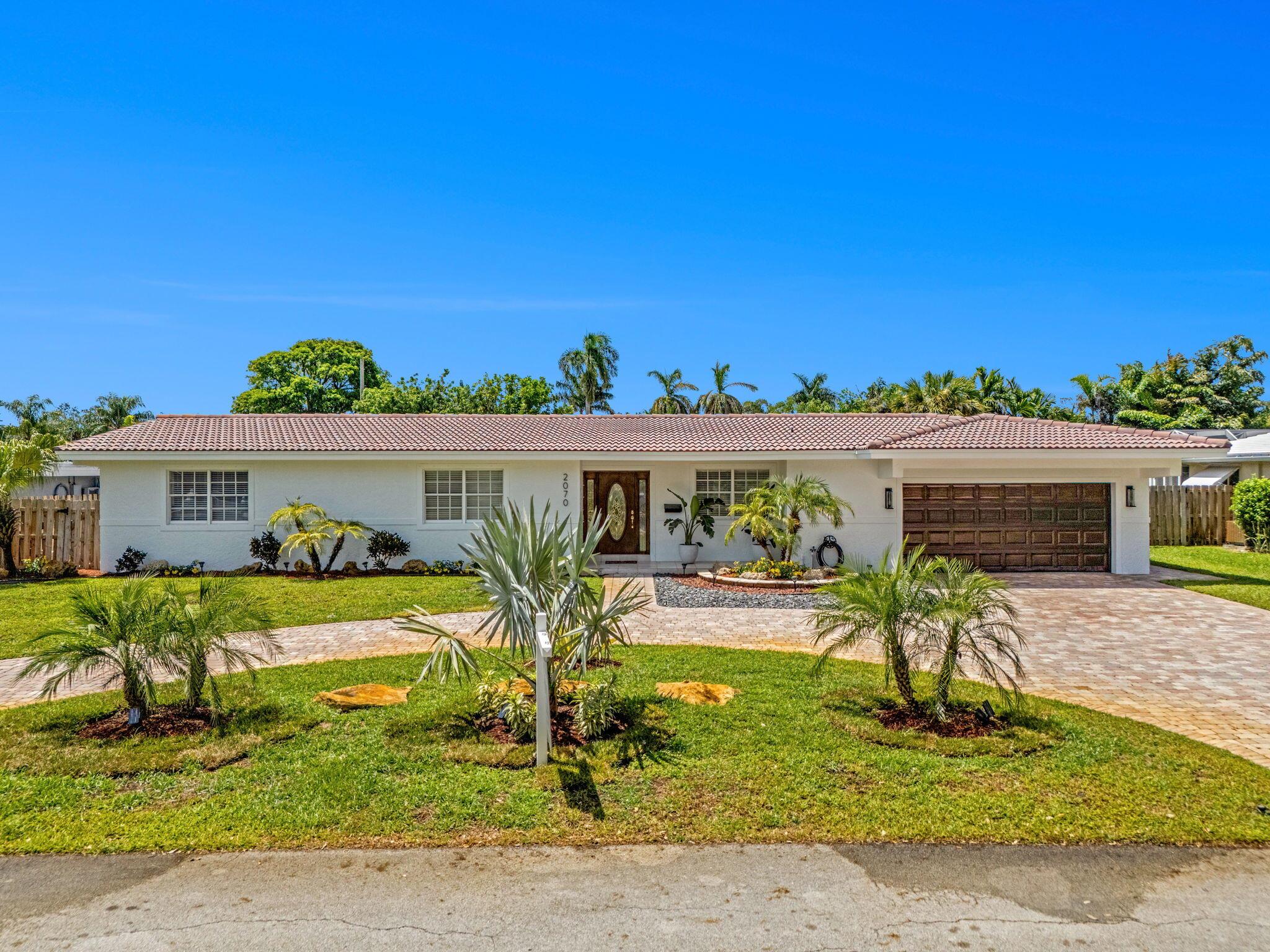 Exceptional renovation three bedroom two bath two car garage pool home on one of the largest lots available in lighthouse point at 12,325 feet. This beautiful home has been tastefully renovated, including new porcelain floors, New built-in closets, new wood Kitchen Cabinets new GE appliances, new book match countertops, and backsplash new lighting with Ceiling fans in every room, AC garage.entertaining in this backyard with friends and family on the weekends will make memories for a lifetime with a brand new pergola 20 x 14 providing the perfect area for your summer Kitchen beautiful kidney shaped pool and a yard measuring over 104 feet wide. It's a must see for any buyer in lighthouse Point.