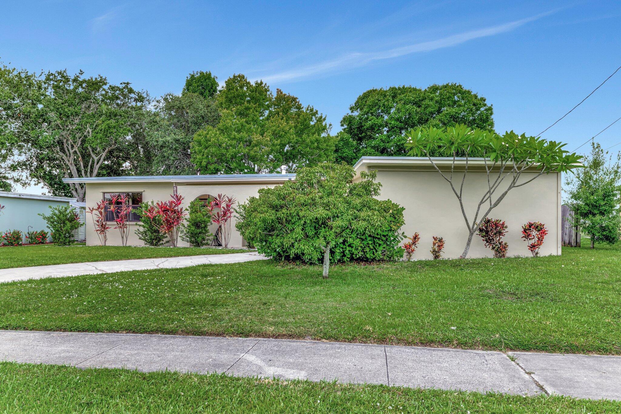 Beautiful 3 Bedroom, 2 Bathroom, 1 Car Garage Home in the Desirable Sandpiper Bay Area Across From Lake for Privacy. Remodeled Bathrooms & Wood Floors Throughout. One of the Standout Features of this Home is the Huge Screened Patio. This Spacious Outdoor Area Provides the Perfect Setting for Enjoying the Florida Lifestyle, Whether You're Sipping Morning Coffee or Hosting Evening Gatherings, All While Being Shielded from the Elements. Roof 2019, HWH 2024, AC in 2024. This Home is Located Within Minutes of Golf Courses, Shopping and is a Must See!