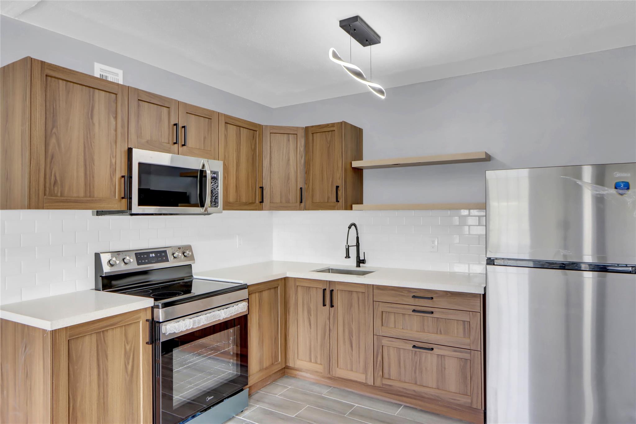 Beautifully remodeled East Boca condo in a prime location! Just east of I-95 and minutes to FAU, the beach, and Mizner Park. This updated unit features a sleek new kitchen with quartz countertops and modern cabinetry, stylish tile flooring throughout, and a fully renovated bathroom. Brand new appliances included. Enjoy the convenience of an on-site laundry room. The building is currently undergoing exterior repairs and fresh repainting — a great time to move in and enjoy the upgrades!