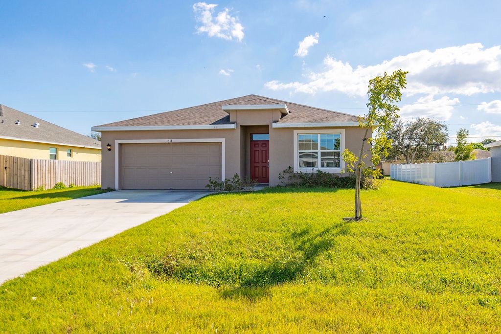 Photo of 1314 SW Goodman Avenue, Port Saint Lucie, FL 34953 (MLS # R11061108)
