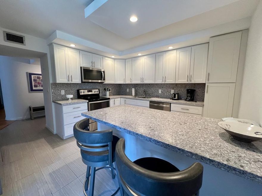 Bright, spacious and beautiful describes this 2 bedroom 2.5 bathroom corner unit with optional 3rd bedroom. This rarely available Salisbury model has been completely remodeled with a new kitchen and bathrooms. Spacious master bedroom with huge custom fitted closet. 2 screened in balcony’s one from the kitchen and one that runs the length of the condo overlooking the pool and gardens of Grandview. Full size washer and dryer. The complex offers a heated pool, community room, gym jacuzzi, BBQ, additional storage. 24 hour gated entrance with guard and secure lobby.  Very close to shopping, entertainment, beach, airport and walking distance to houses of worship. Hurry this is a great unit!