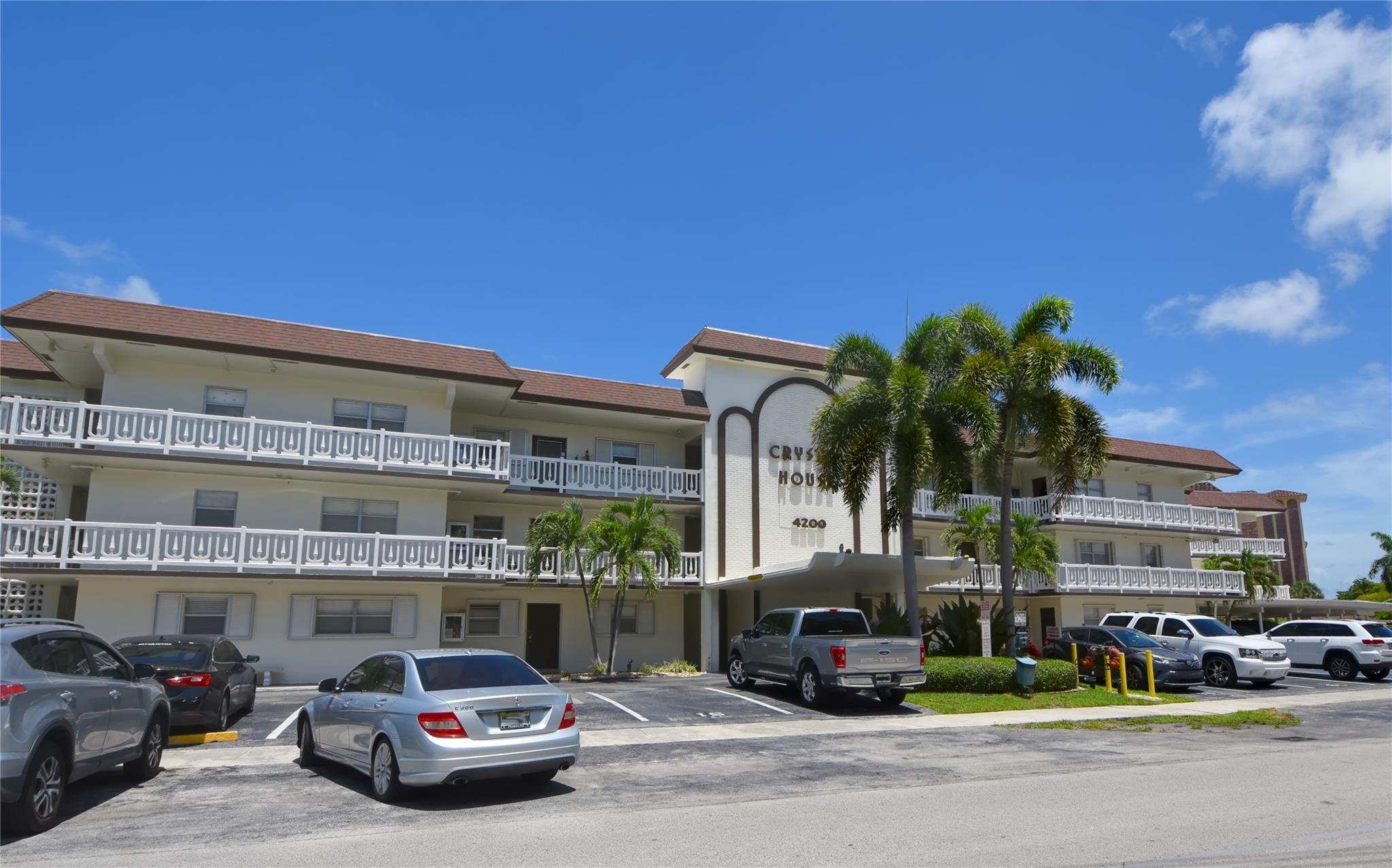 Rarely available, light & bright 2 bedroom, 2 full bath "first" floor unit in Crystal House Condo with pool and tropical landscaped courtyard views. Unit features updated kitchen, stainless steel appliances, crown molding, all popcorn removed & neutral paint. All "tile" flooring, great split floor plan, with plenty of closet space with a walk-in in the master, roomy second bedroom and a hallway linen closet. Equipped with hurricane shutters. SIRS, 50-year certification, completed. Central location with quick access to 95, turnpike, beach & shopping. Friendly and well managed building. OK to lease 1st year.