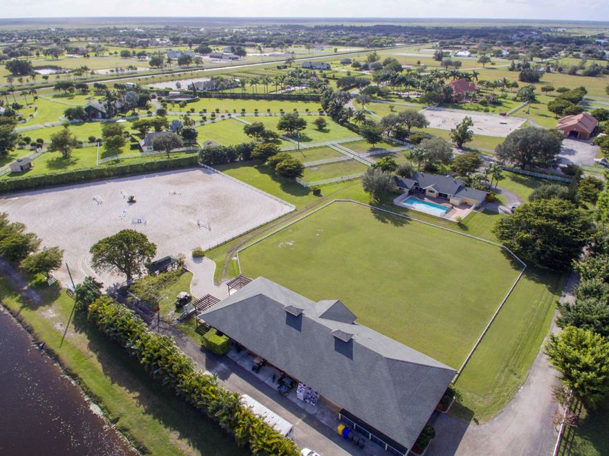 Arguably the best location in Palm Beach Point! One of the shortest hacks to the show of any farm in this prestigious gated community.  This adorable 5 acre farm is move in ready and is only steps away from the bridle path land bridge to Grand Prix Village. This exceptionally laid-out property offers a 10 stall CBS center aisle barn, riders lounge, office, a grass jump field, a large all weather ring, excessive turnout and a quaint 3 bedroom + den house with private pool.  Located on one of the most private and peaceful streets  in the community this farm provides a serine sanctuary from the busy horse show just a few minutes away.  Adjacent land also for sale!!  See MLS listing RX-10312809.