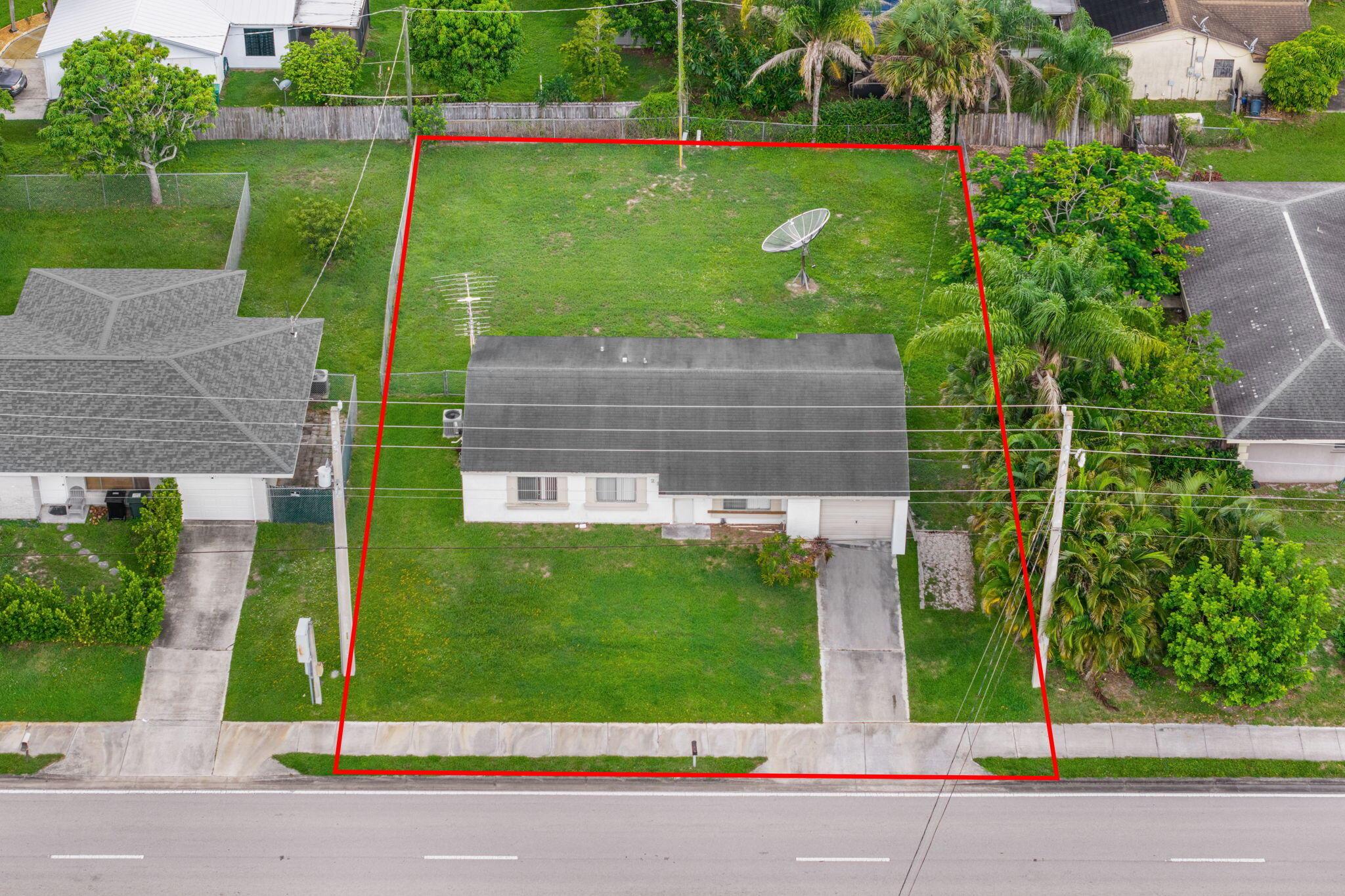3 bedroom, 2 bath home in Port St. Lucie with 1 car garage. Large fenced yard and screened in porch. AC new in 2020. Large kitchen with dining and opens to living room. SELLER SAYS MAKE AN OFFER.