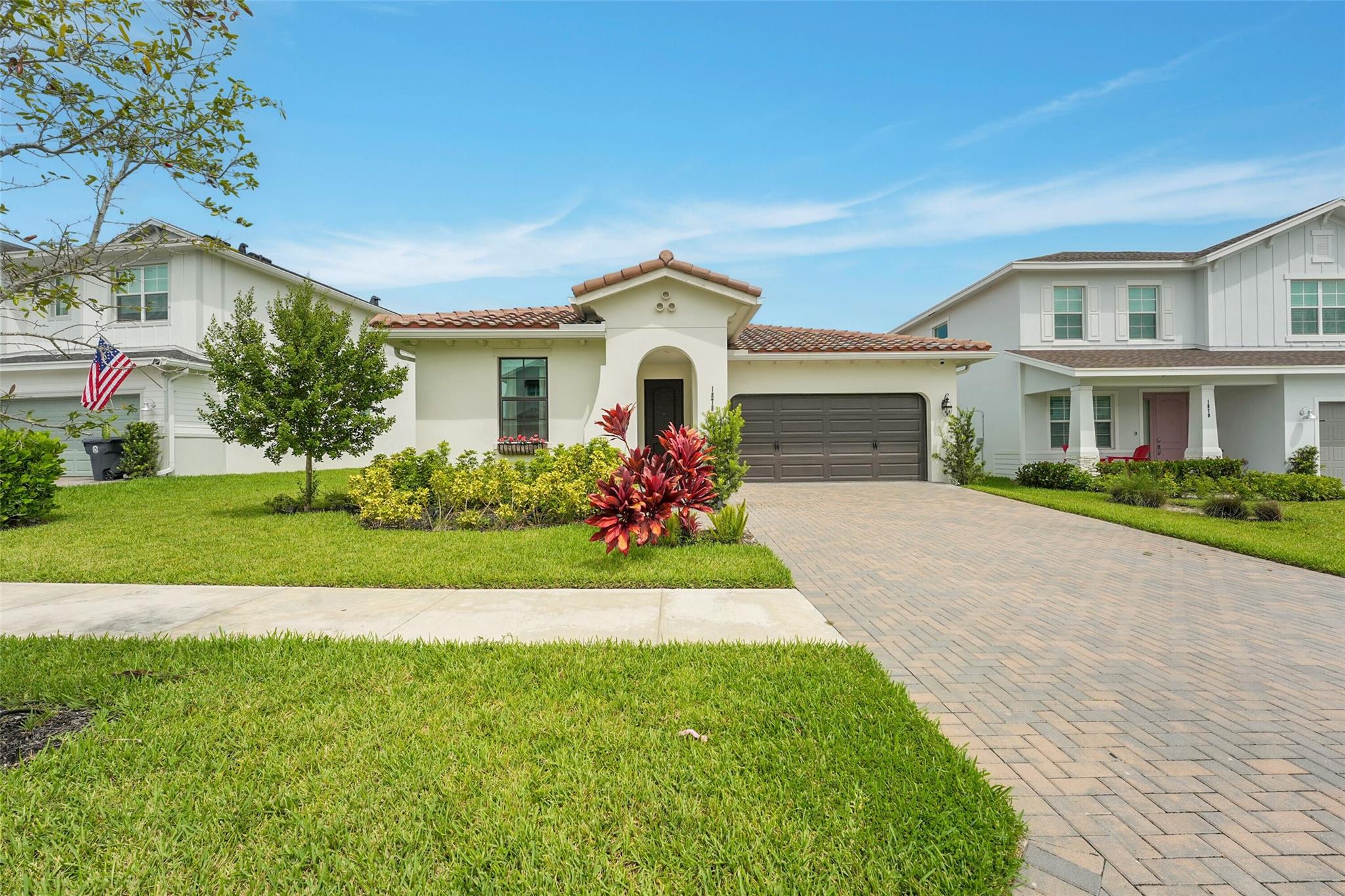 Elegantly upgraded 3 bedroom 2 bath home with barrel tile roof and 2 car garage. Over $85K in upgrades! LVP flooring & stunning elegant porcelain flooring! High ceilings, built in fireplace! Open kitchen with marble backsplash, quartz countertops, gas slide in self cleaning oven with overhead vent and top quality appliances. New smart home technologies include WIFI and controls for alarms, cameras, thermostat, locks, lights, and garage door. Relax on your screened in patio overlooking a lush, open backyard with garden views. Custom primary ensuite. Fresh organic produce for the residents! Enjoy the clubhouse with fitness center, trails, courts, fields, lakes. Top-rated Wellington schools, with Saddle View Elementary. Arden community known as the Agrihood with resort-style amenities!