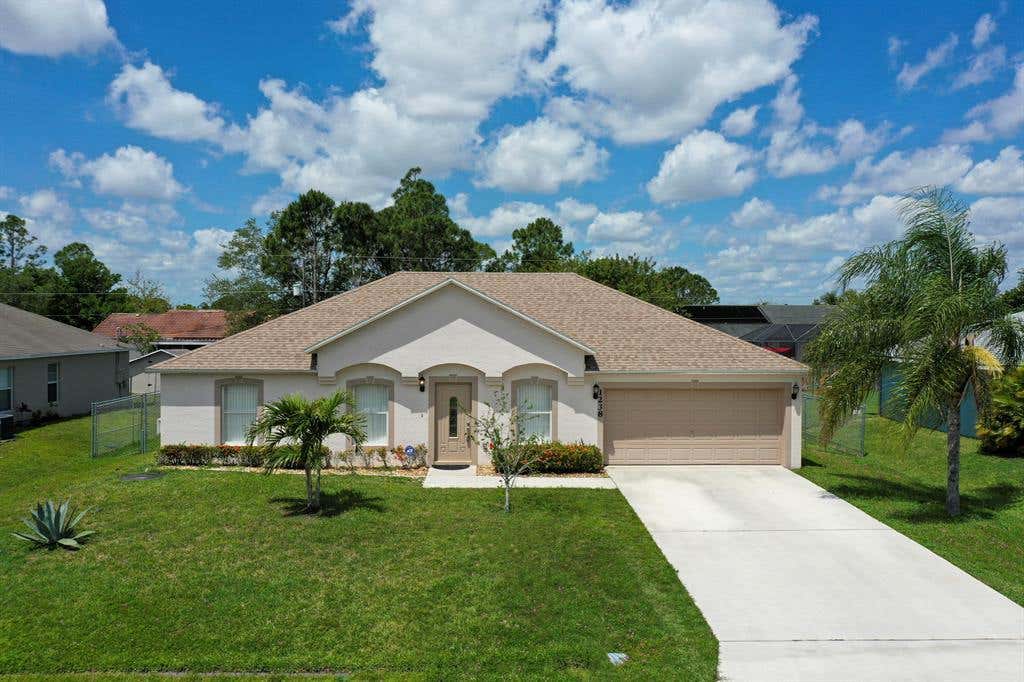Photo of 1238 SW Avens Street, Port Saint Lucie, FL 34983 (MLS # R10709818)