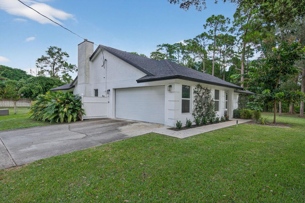 Photo of 13761 158th St, Jupiter, FL 33478 (MLS # F10533193)
