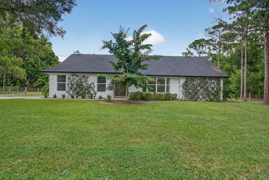 Renovated Jupiter Farms CBS 3/2/2 pool home! Located on a quiet dead-end paved road (no thru traffic). 1.15 acres with 2022 roof. Luxury vinyl flooring throughout with shaker-style doors, kitchen featuring new 42’’ upper cabinets, quartz countertops, and stainless steel appliances including wine fridge. Both bathrooms feature new tile throughout, vanities, millwork, and lighting. All new light fixtures/fans and baseboard throughout. Impact garage door & patio sliders. The pool patio features gorgeous stained/sealed tongue and groove ceiling & cabana guest bath access.